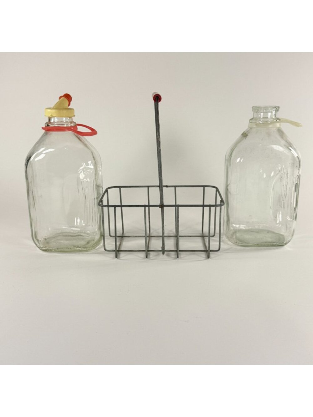 Vintage 2 Clear Glass Half Gallon Milk Jugs Plastic Handle Metal Carrier